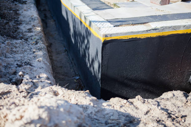 Professional Waterproofing technician working in Tyner, IN